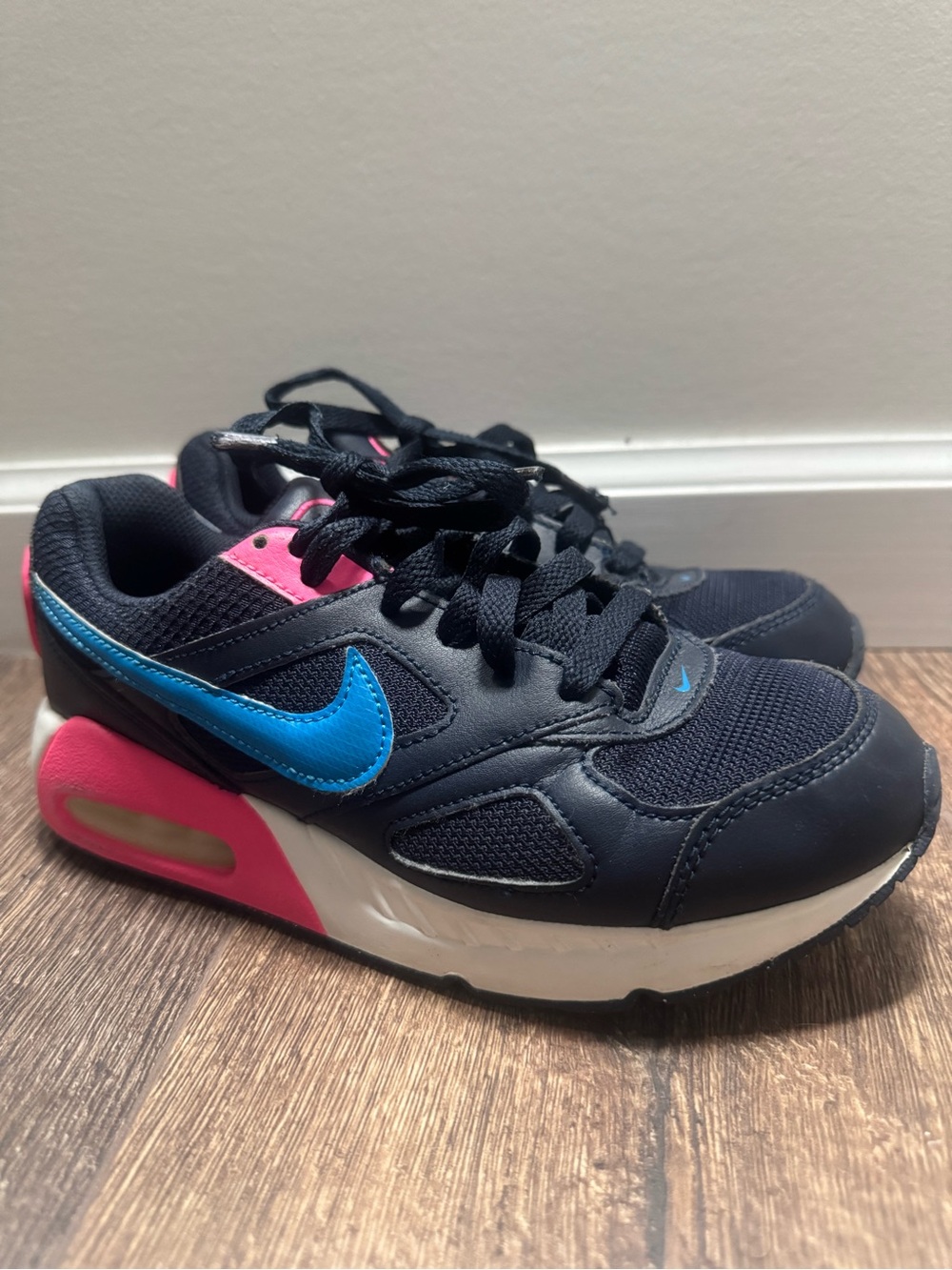 Nike Black Sneakers with Blue Swoosh and Pink Heel Accents